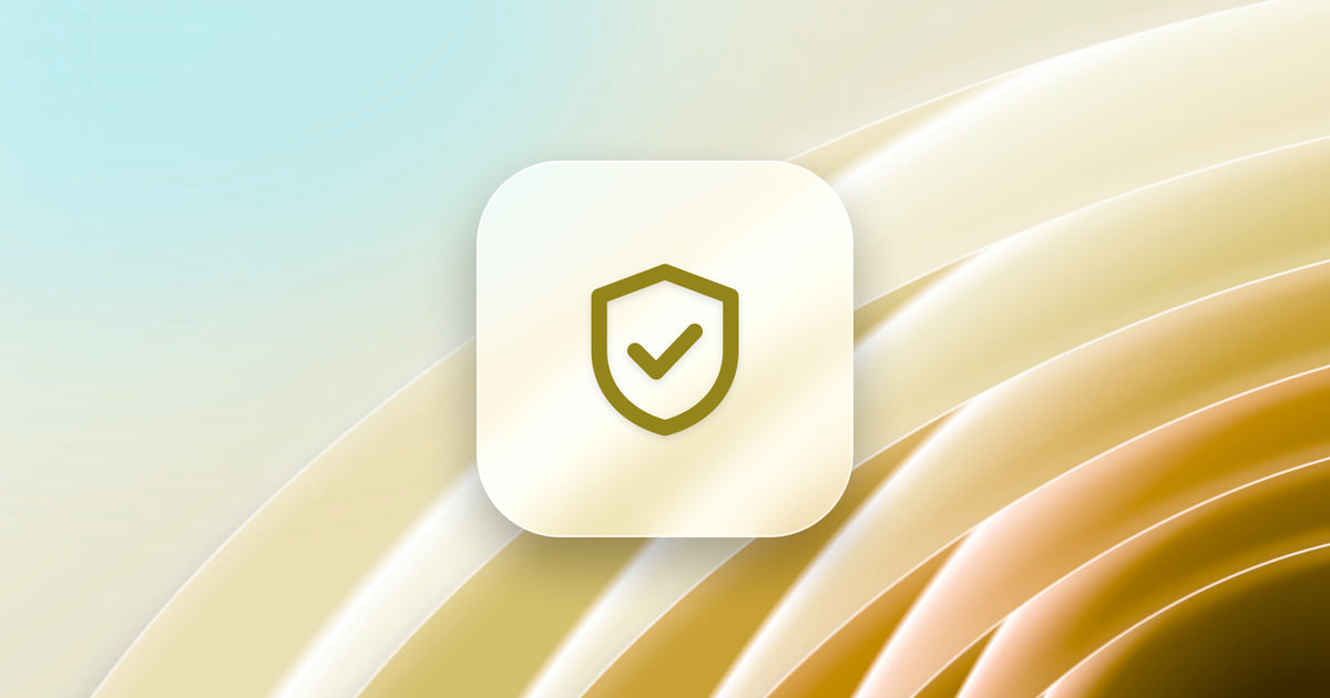 A shield with a checkmark on a frosted glass tile, over a gold wallpaper.