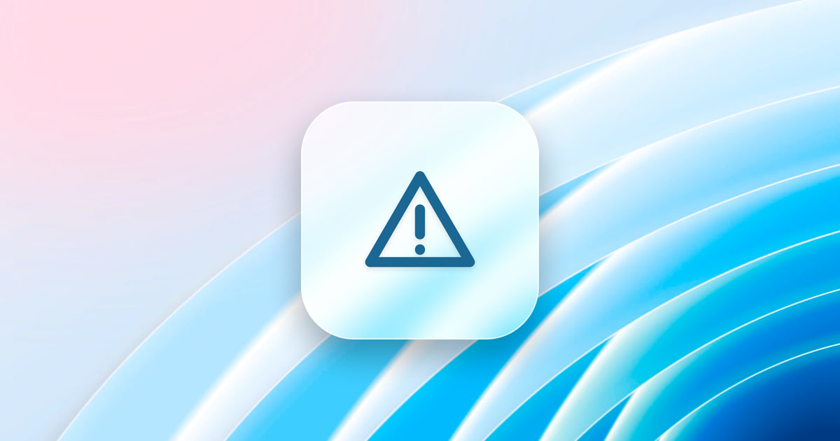 A warning triangle on a frosted glass tile, over a blue wallpaper.
